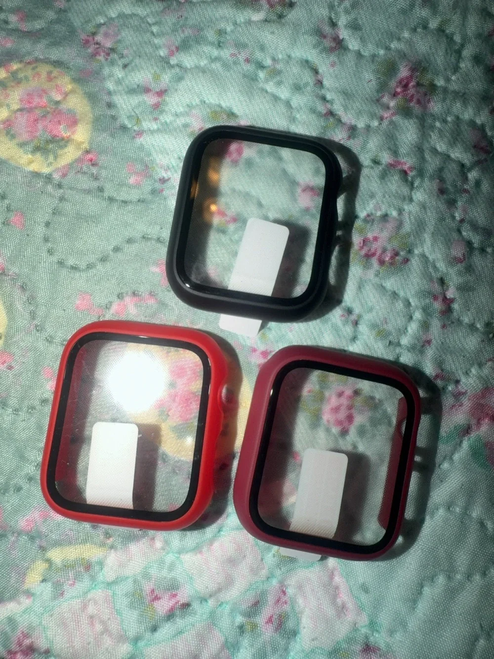 Silver Smartwatch with Multiple Colored Protective Cases and Charger
